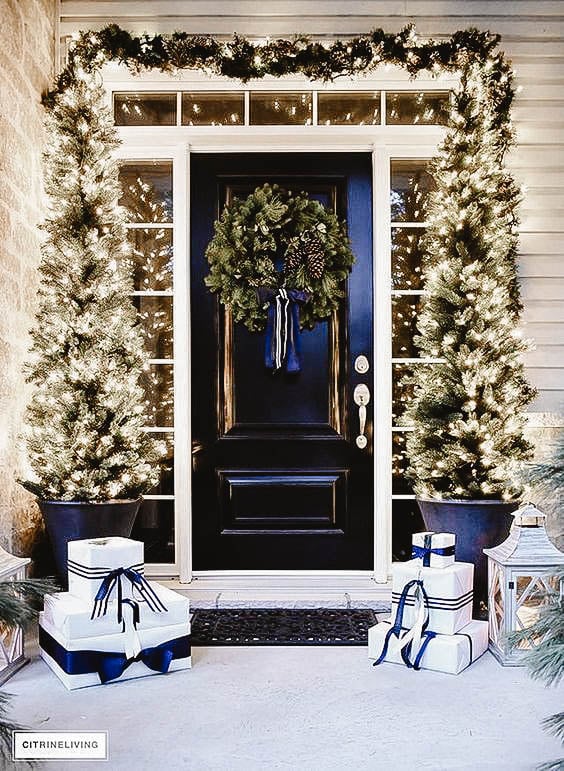 You can see a front porch decorated in a chic look.
