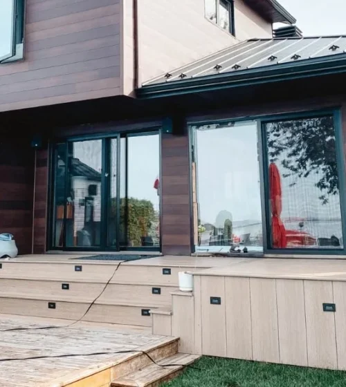 Modern cottage extension with outdoor patio and seating area