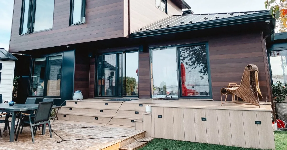 Modern cottage extension with outdoor patio and seating area