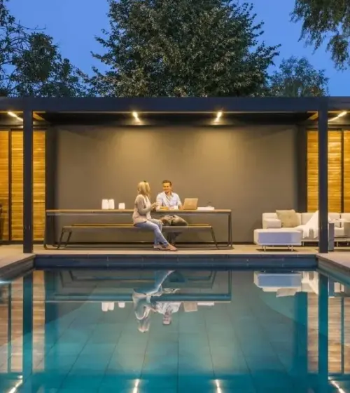 Modern pool house with a seating area, supported by screw pile foundations.