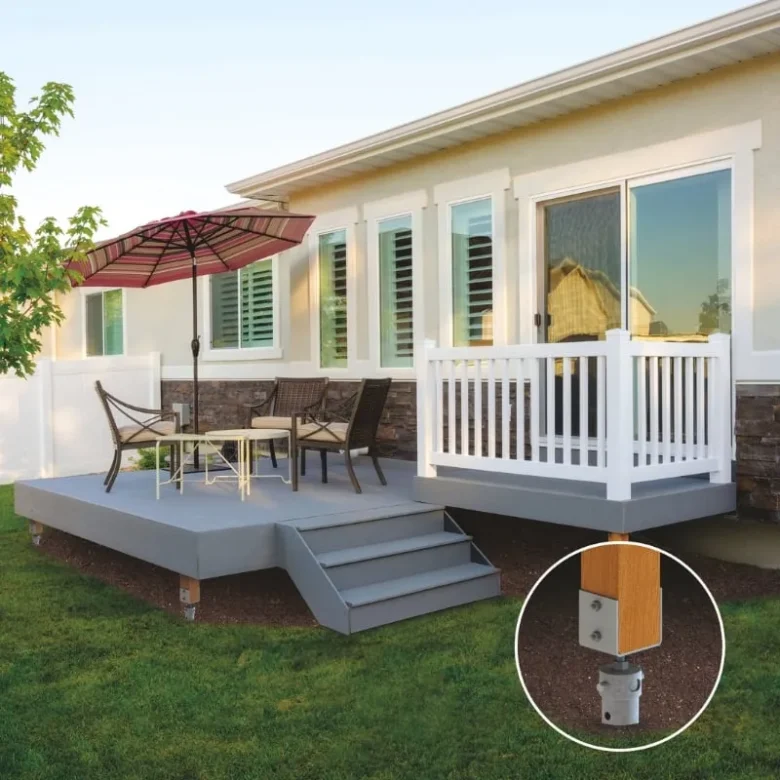 Modern backyard deck with outdoor seating and an umbrella, supported by screw pile foundations for durability and stability.